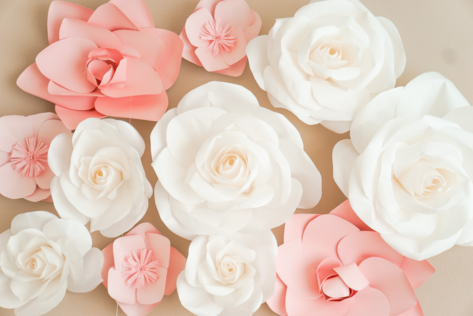 Lifestyle Blogger Katelyn Jones of A Touch of Pink shares her Baby Girl's Nursery and Paper Flowers above the crib