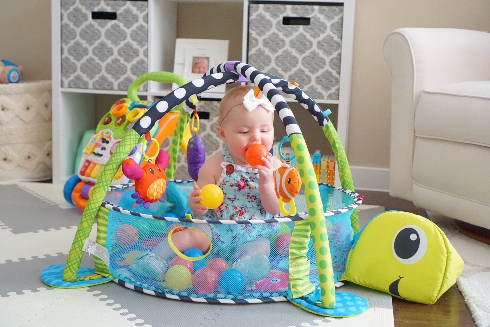 Katelyn Jones A Touch of Pink buybuy BABY The Infantino Grow-With-Me Activity Gym and Ball Pit