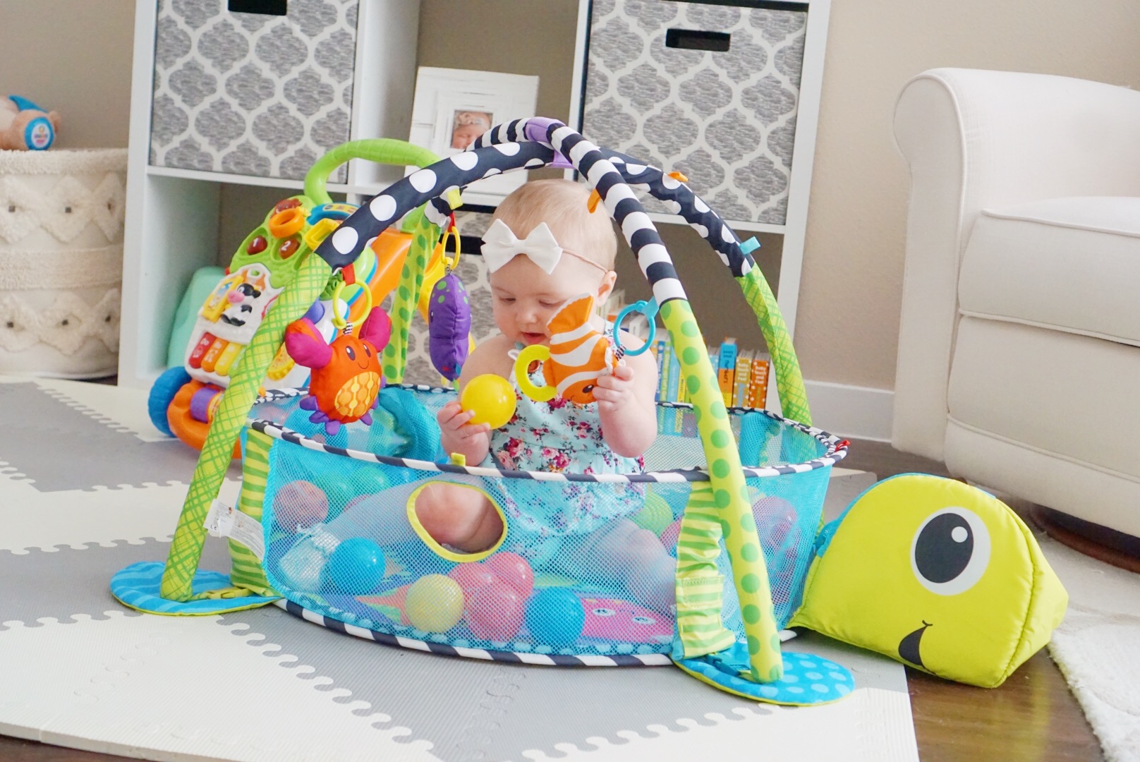 Katelyn Jones A Touch of Pink buybuy BABY Infantino Grow-With-Me Activity Gym and Ball Pit