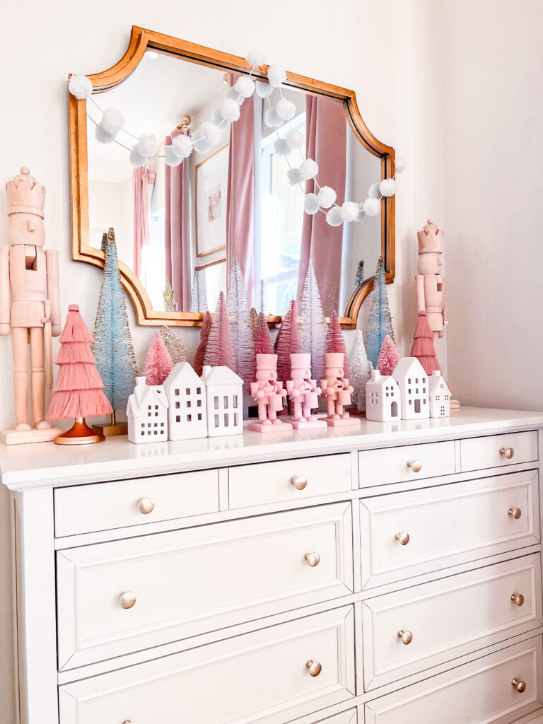 Pink Christmas Decor little girl Christmas bedroom Katelyn Jones A Touch of Pink Blog Pink Nutcrackers Bottle Brush Trees Christmas Dresser