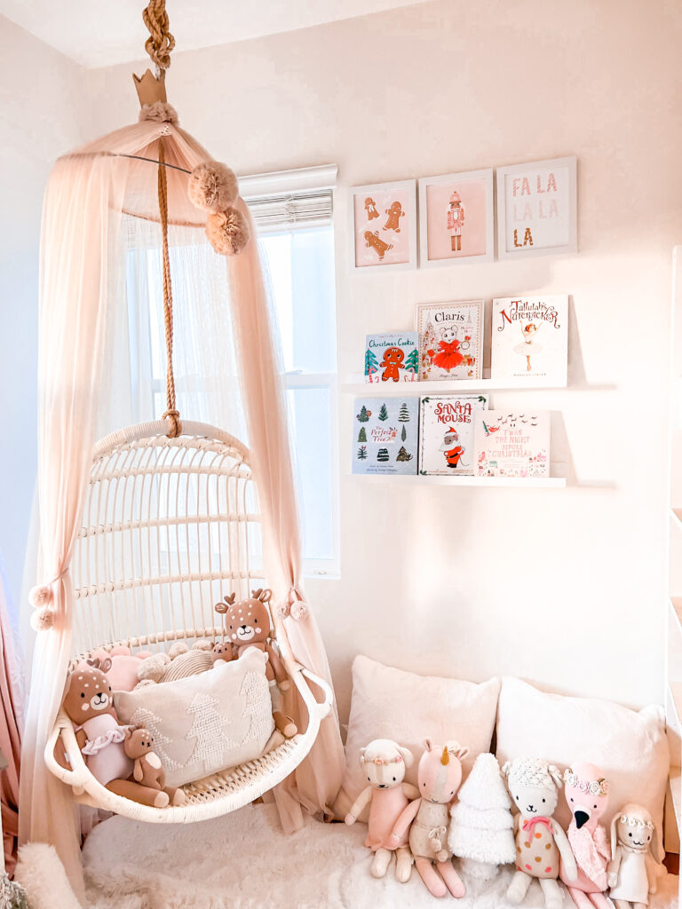 little girl Christmas bedroom Katelyn Jones A Touch of Pink Blog Pink Christmas Decor Hanging Rattan Chair